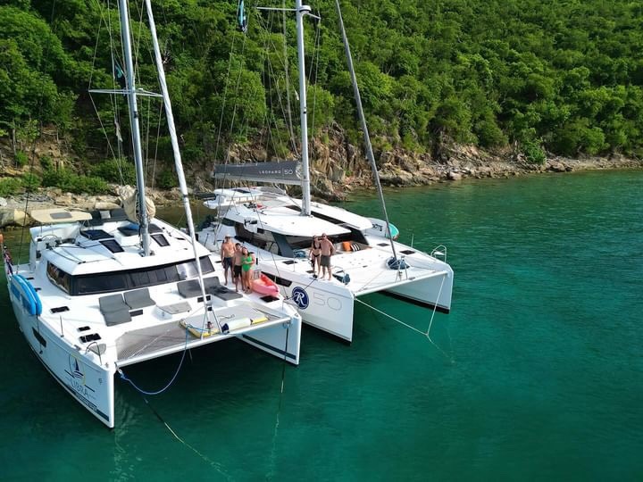 yachts in tandem in the BVI tandem catamarans tied up to eachother for parties larger than 8 that need more than 1 boat