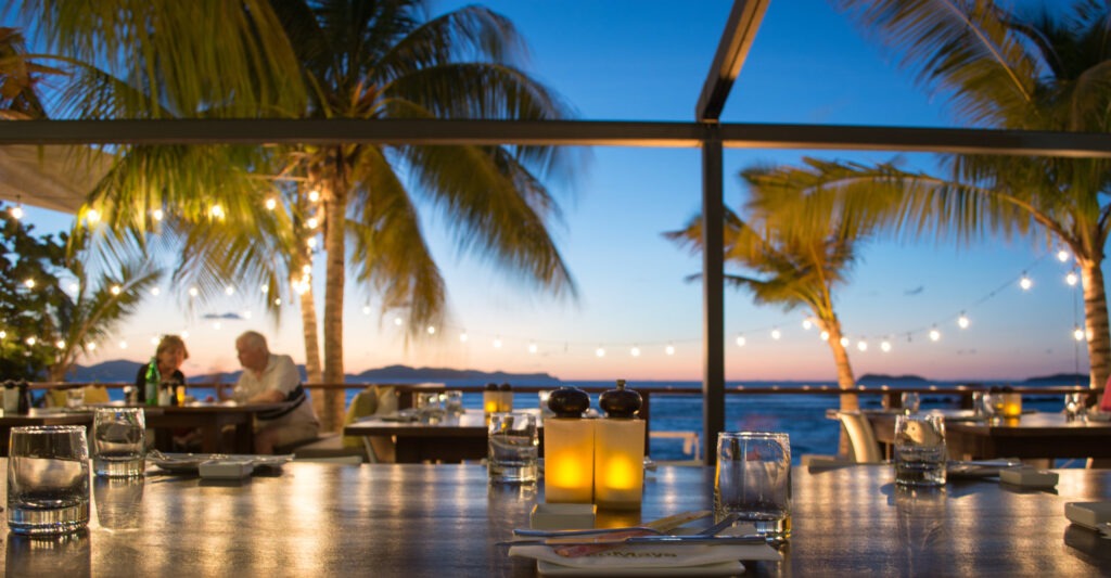 beautiful sunset view from CocoMaya beach lounge and restaurant in Virgin Gorda, BVI. Make this a stop on your 7 night charter itinerary