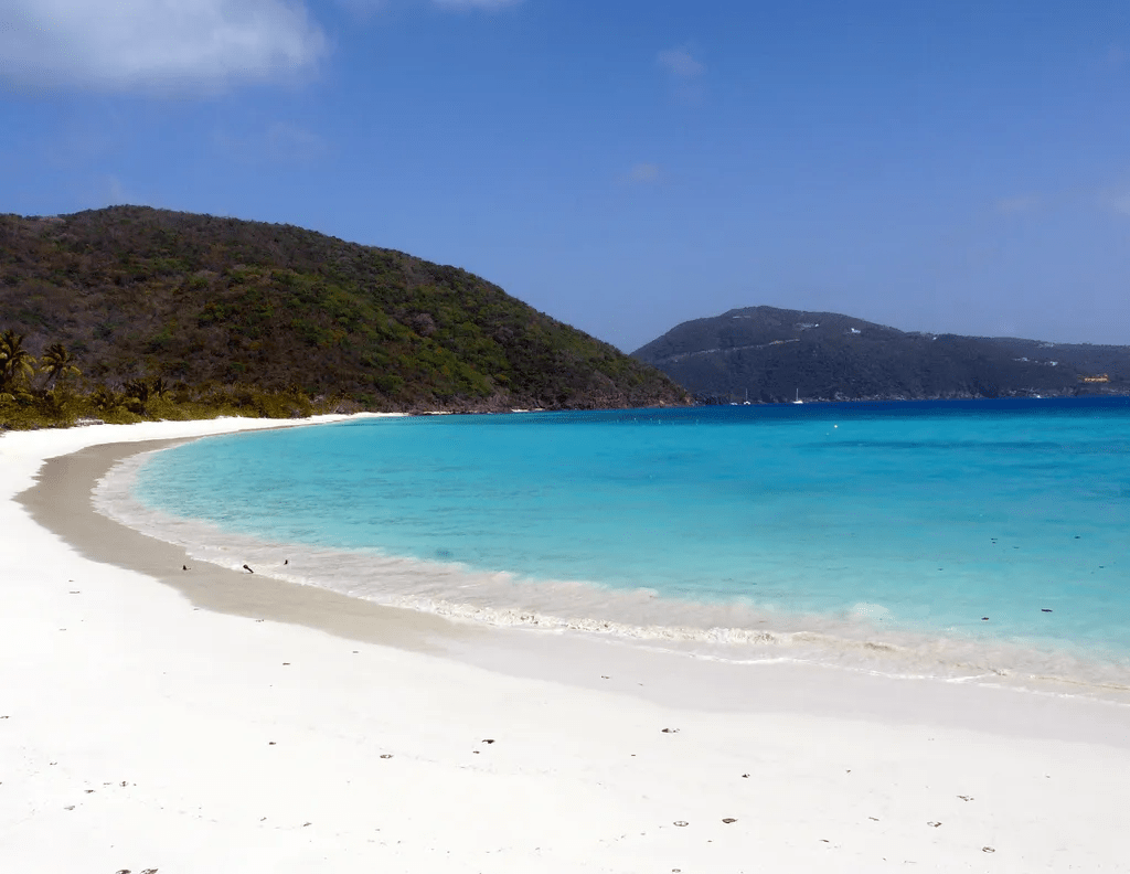 a giant white sand beach on Guana island in the BVI. Visit Guana island on your crewed yacht charter with sheer yachting